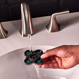 Washing the top removable head under running water